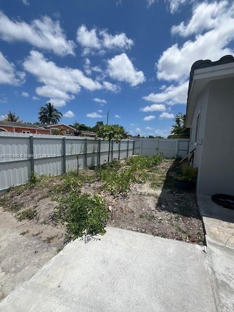 view of yard featuring fence