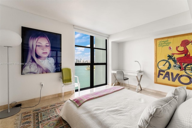 bedroom featuring baseboards