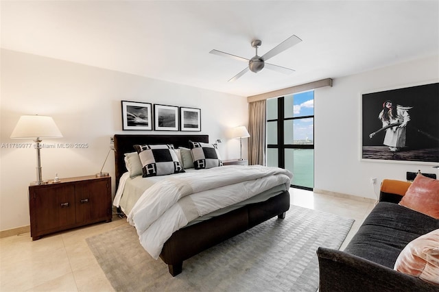 bedroom featuring light tile patterned floors, baseboards, a ceiling fan, and floor to ceiling windows