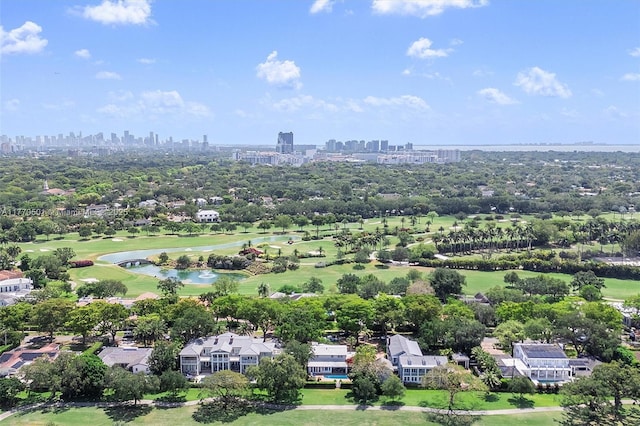 aerial view with a view of city, view of golf course, and a water view