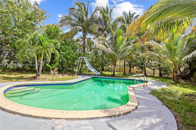 outdoor pool with a water slide