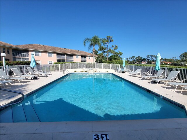 575 Augusta Blvd Unit 8, Naples, FL 34113 - pool with a patio and fence