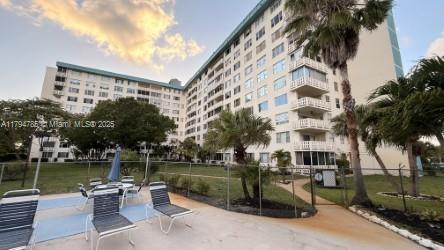 4330 Hillcrest Dr Unit 214, Hollywood, FL 33021 - view of building exterior featuring fence
