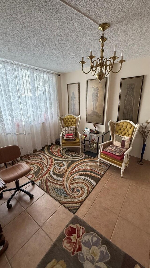 4330 Hillcrest Dr Unit 214, Hollywood, FL 33021 - living area featuring a chandelier, a textured ceiling, and tile patterned flooring