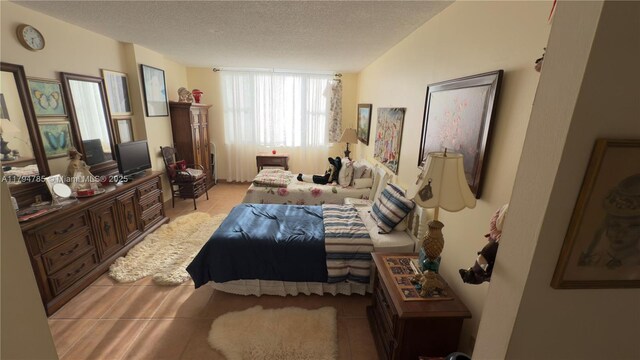 4330 Hillcrest Dr Unit 214, Hollywood, FL 33021 - tiled bedroom featuring a textured ceiling