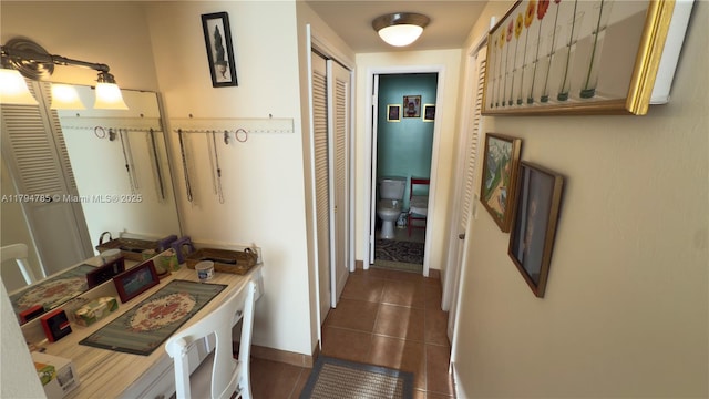 4330 Hillcrest Dr Unit 214, Hollywood, FL 33021 - corridor with baseboards and dark tile patterned floors