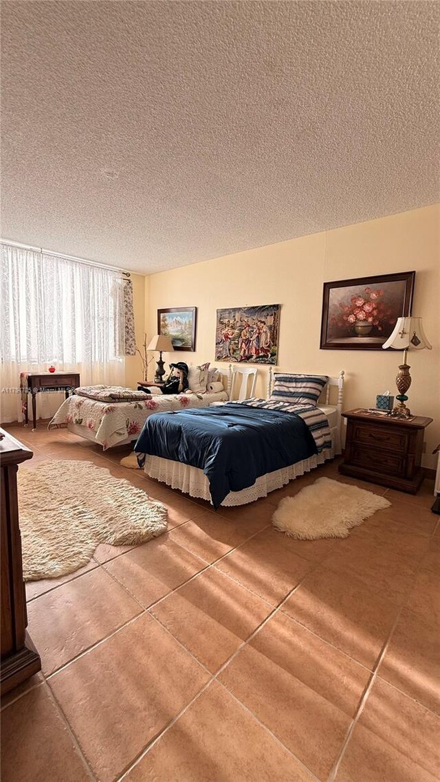 4330 Hillcrest Dr Unit 214, Hollywood, FL 33021 - tiled bedroom with a textured ceiling