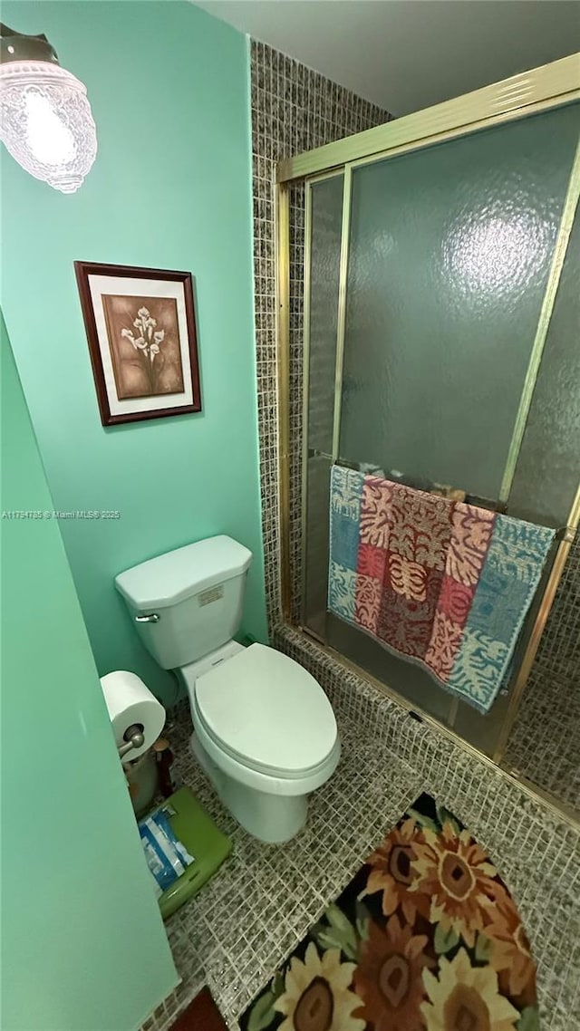4330 Hillcrest Dr Unit 214, Hollywood, FL 33021 - bathroom with toilet, tile patterned floors, and combined bath / shower with glass door