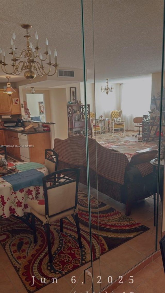 4330 Hillcrest Dr Unit 214, Hollywood, FL 33021 - living room with a chandelier, a textured ceiling, and light tile patterned floors