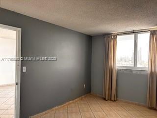 345 Ocean Dr Unit 904, Miami Beach, FL 33139 - empty room featuring light tile patterned floors and a textured ceiling