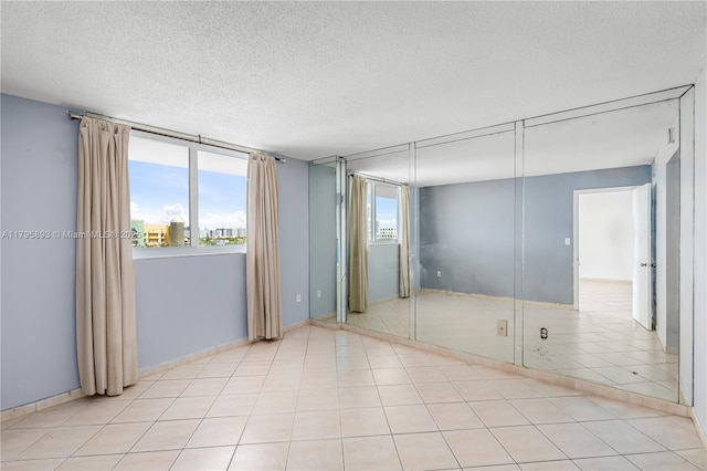 345 Ocean Dr Unit 904, Miami Beach, FL 33139 - unfurnished bedroom featuring a textured ceiling