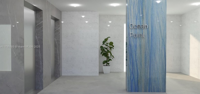 hall with concrete floors