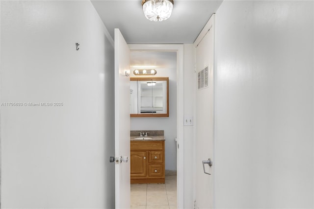 345 Ocean Dr Unit 904, Miami Beach, FL 33139 - hallway featuring a sink and light tile patterned floors