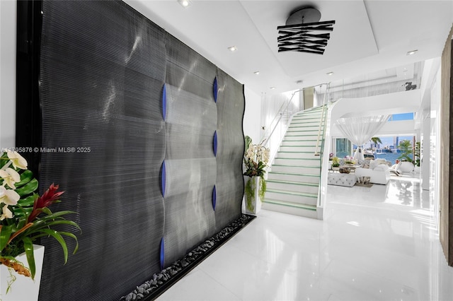 hall featuring stairway, recessed lighting, and tile patterned floors
