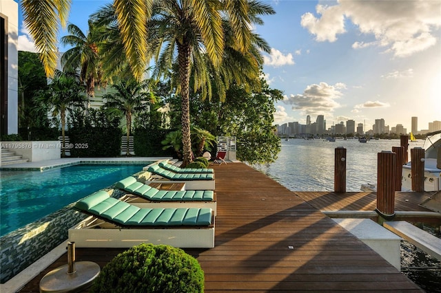 dock area with a water view and a view of city