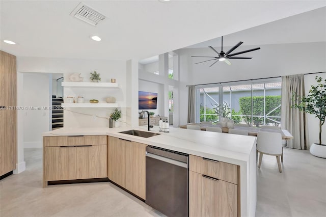 kitchen featuring light brown cabinetry, a sink, dishwasher, visible vents, and modern cabinets