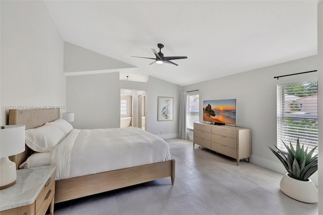 bedroom with baseboards, connected bathroom, ceiling fan, and lofted ceiling