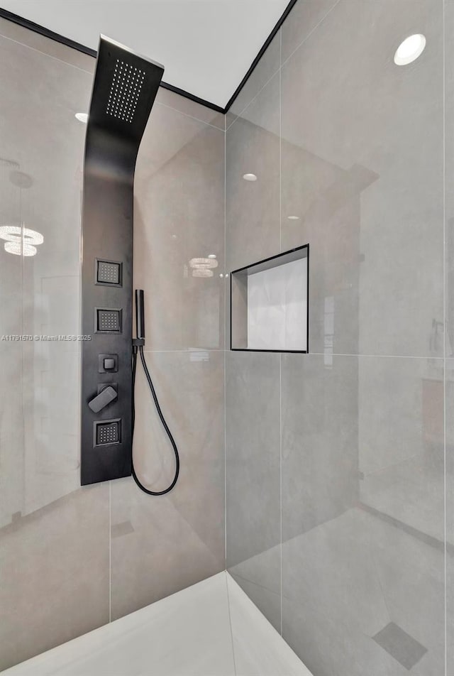full bathroom with a tile shower