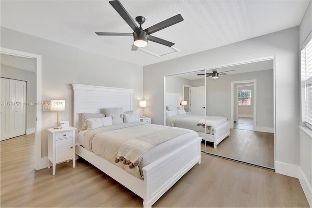 bedroom featuring baseboards, ceiling fan, and light wood-type flooring