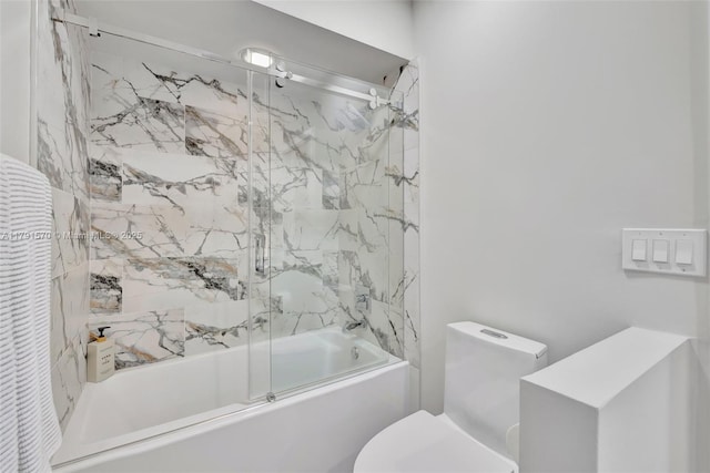 full bathroom featuring combined bath / shower with glass door and toilet