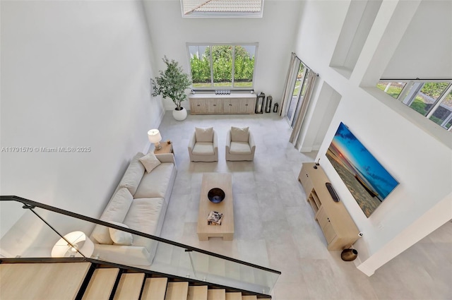 living area featuring a high ceiling