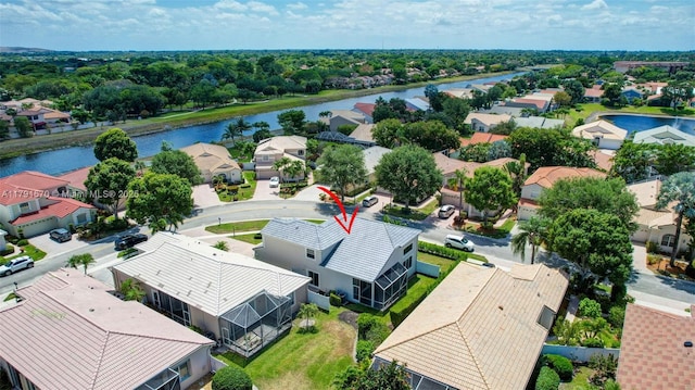 bird's eye view with a water view and a residential view