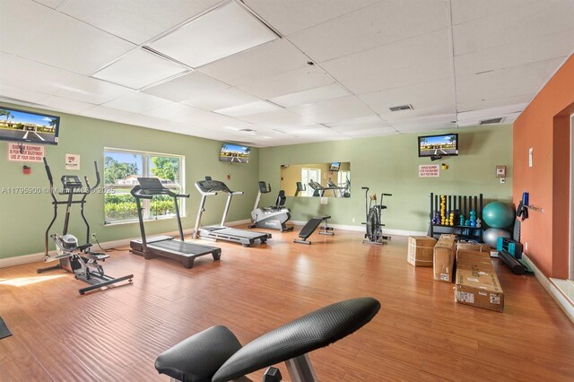 2935 W Crosley Dr Unit B, West Palm Beach, FL 33415 - gym featuring wood finished floors, a drop ceiling, and baseboards