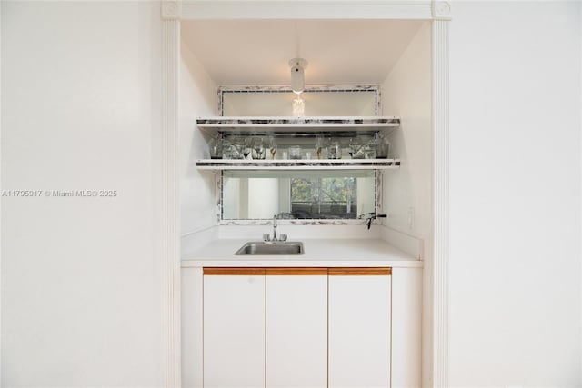 bar with a sink and indoor wet bar