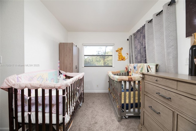 carpeted bedroom featuring baseboards