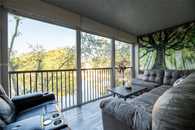 sunroom featuring an outdoor hangout area