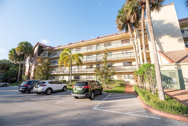 view of property with uncovered parking