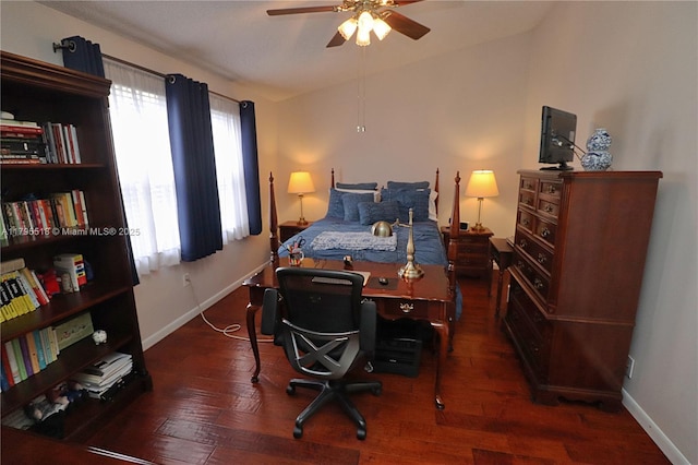 bedroom with baseboards, ceiling fan, and wood finished floors