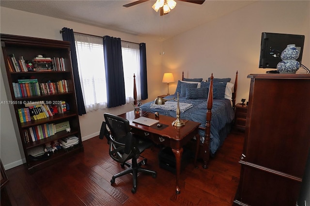 bedroom with baseboards, ceiling fan, and wood finished floors