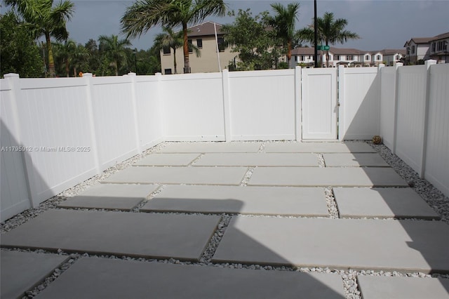 3413 W 113th St, Hialeah, FL 33018 - fenced backyard featuring a gate and a patio