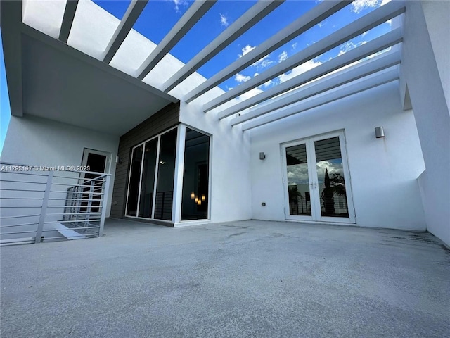 view of patio featuring french doors and a pergola