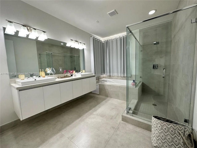 full bath featuring tile patterned flooring, visible vents, a shower stall, and a garden tub