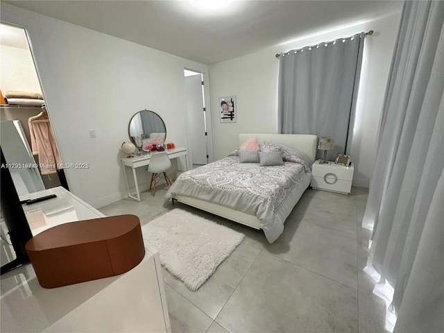 bedroom with a walk in closet