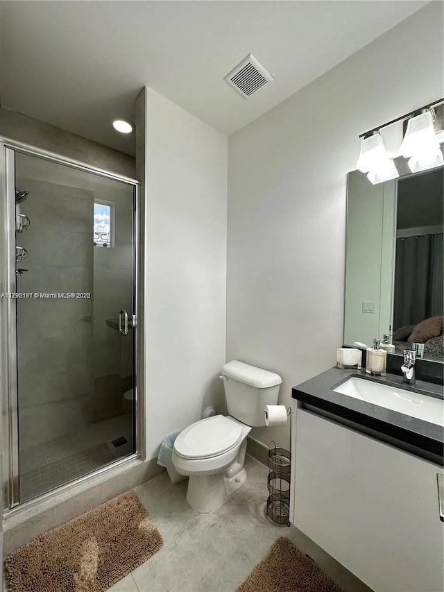 full bath with visible vents, a stall shower, toilet, and vanity