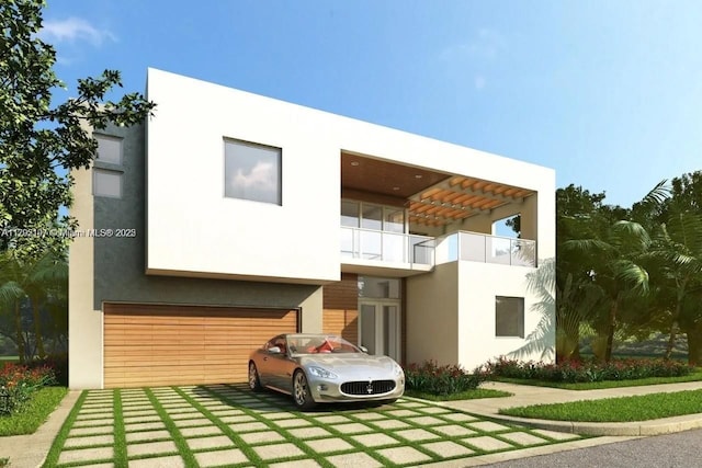 view of front of home featuring a garage, stucco siding, and driveway