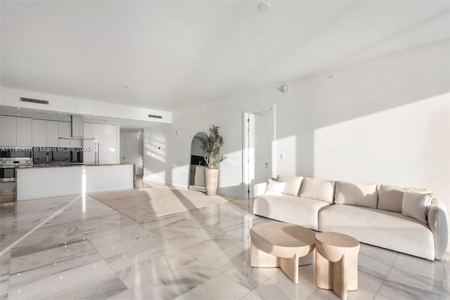 living room featuring visible vents and marble finish floor