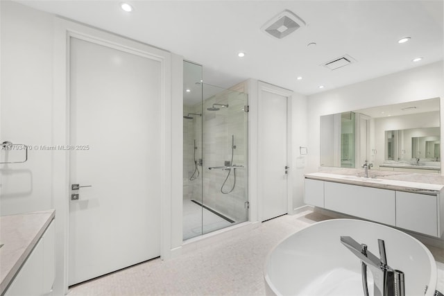 full bath with vanity, recessed lighting, visible vents, and a shower stall