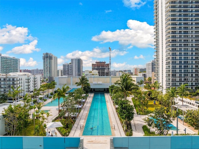 view of swimming pool featuring a view of city
