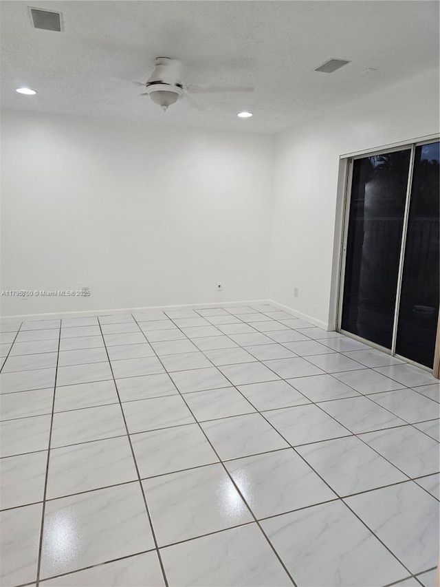 spare room featuring a ceiling fan, recessed lighting, light tile patterned flooring, and visible vents