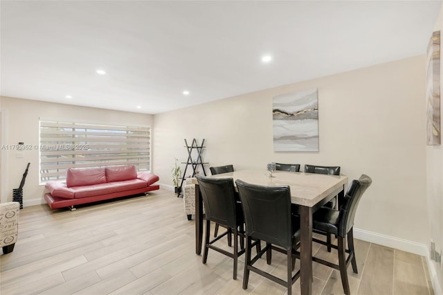 7295 W 14th Ct, Hialeah, FL 33014 - dining area with light wood-style flooring, baseboards, and recessed lighting