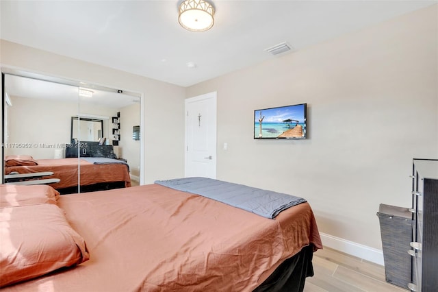 7295 W 14th Ct, Hialeah, FL 33014 - bedroom featuring baseboards and light wood-style floors