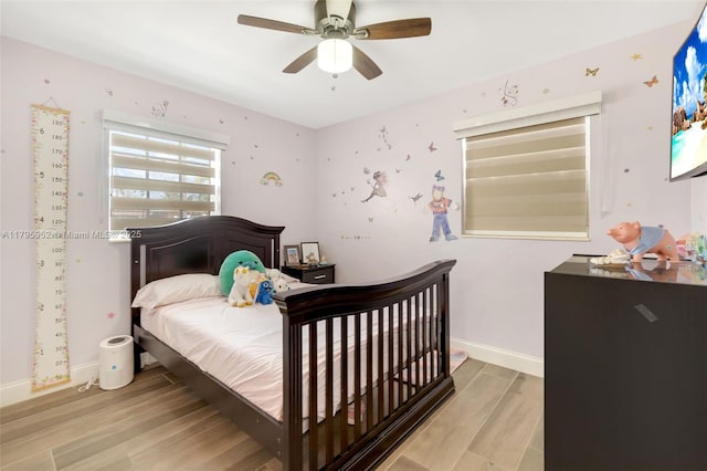 7295 W 14th Ct, Hialeah, FL 33014 - bedroom featuring wood finished floors, baseboards, and ceiling fan