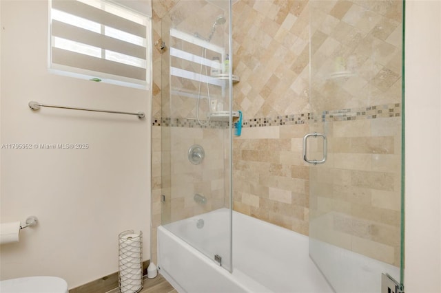7295 W 14th Ct, Hialeah, FL 33014 - bathroom featuring toilet and shower / bath combination with glass door