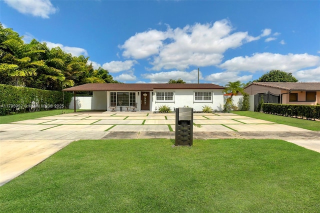 7295 W 14th Ct, Hialeah, FL 33014 - view of front of home featuring stucco siding, concrete driveway, and an attached carport