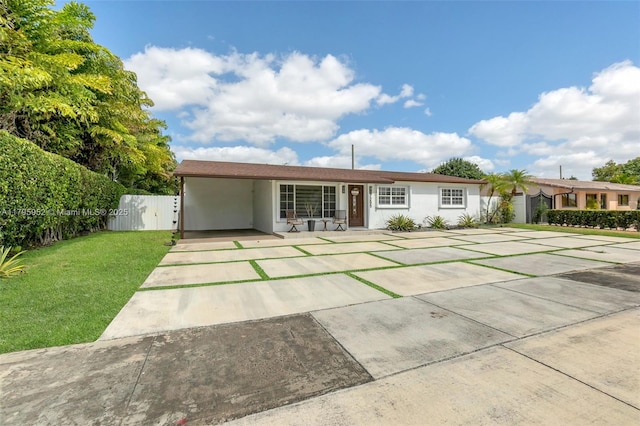 7295 W 14th Ct, Hialeah, FL 33014 - ranch-style home featuring stucco siding, a carport, and driveway