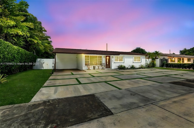 7295 W 14th Ct, Hialeah, FL 33014 - ranch-style house featuring an attached carport, stucco siding, and driveway